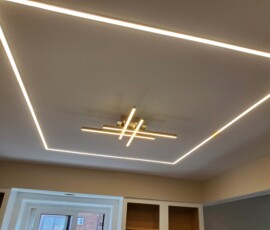 High-end architectural ceiling layout, delivering seamless, shadowless illumination across the room.